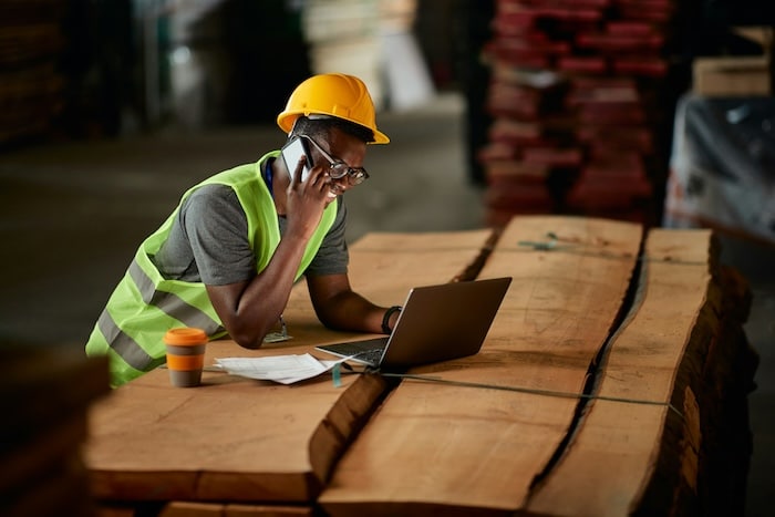 construction worker remotely access application via his laptop